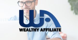 Man sitting at a table working on laptop with the Wealthy affiliate logo